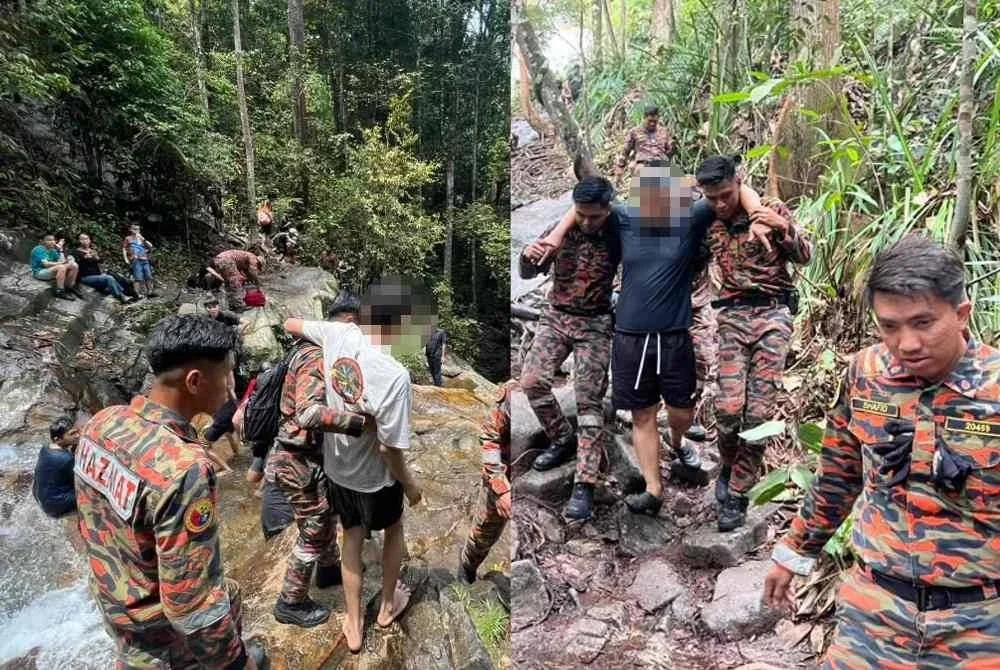 Anggota bomba menyelamatkan kedua-dua mangsa yang cedera ketika beriadah di Air Terjun Kanching, Rawang pada Ahad.