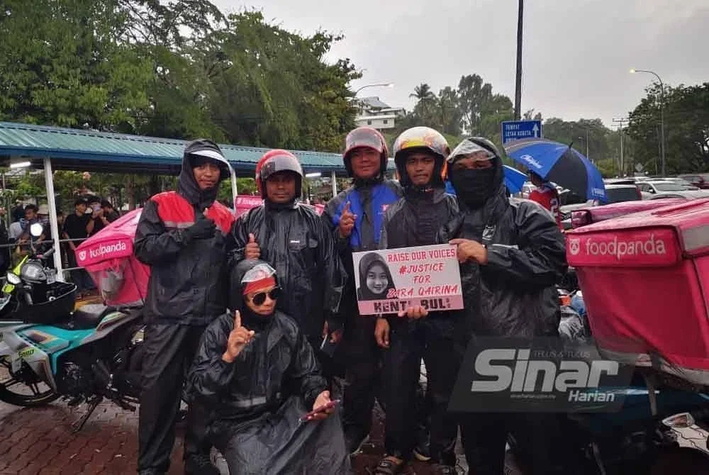 Beberapa orang penghantar makanan setia menanti di pekarangan Jabatan Forensik HQEI, Kota Kinabalu pada Ahad.