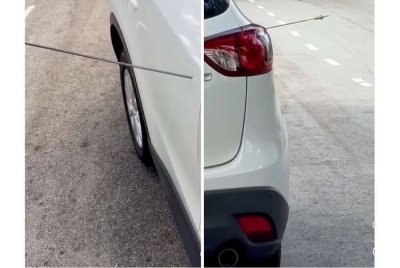 Seorang lelaki terkejut apabila anak panah terkena pada kenderaan dipandunya.