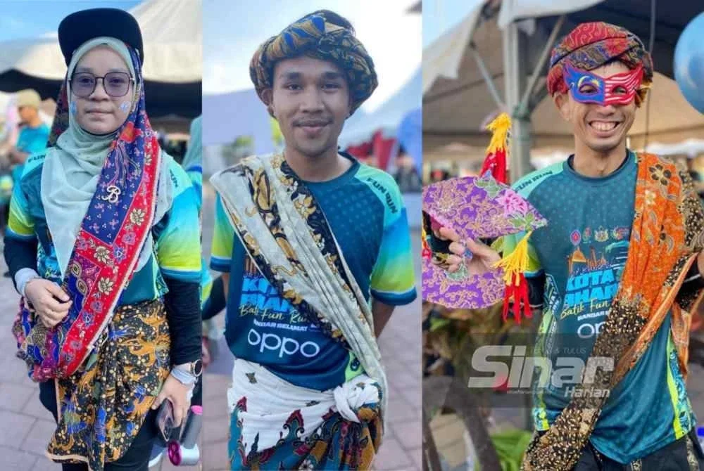 Dari kiri: Faradila, Muhammad Firdaus dan Nik Ahmad Syahriman teruja dapat menyertai Larian Batik Kota Bharu Bandar Selamat 2025 di Dataran Muhammadi, Kota Bharu pada Sabtu.