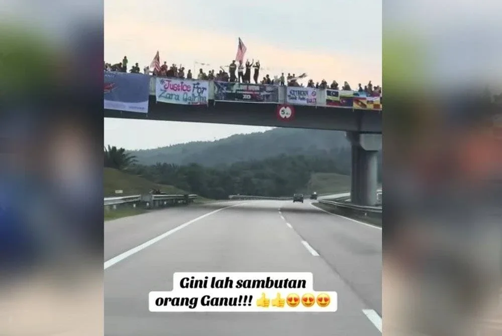 Gambar tular penduduk tempatan mengangkat kain rentang 'Selamat Datang' sebagai tanda meraikan kehadiran pengunjung luar sempena himpunan RXZ di Gong Badak, Kuala Nerus, pada Jumaat dan Sabtu.
