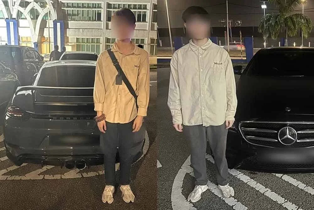 Polis tahan dua pemandu kereta yang diubah suai dipercayai terlibat lumba haram di Lebuh Medini Utama. Foto IPD Iskandar Puteri