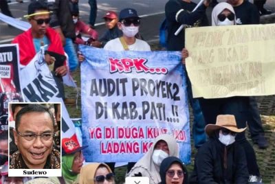 Ratusan mengadakan tunjuk perasaan di hadapan bangunan KPK. - Foto: Agensi