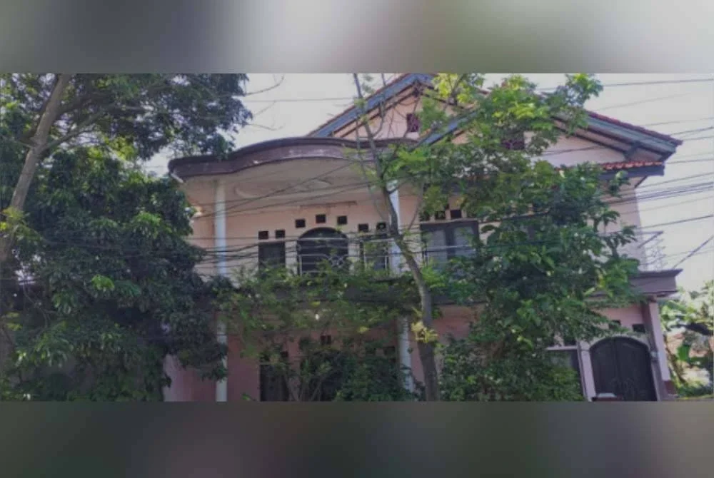 Rumah di mana kesemua mayat ditemui ditanam dalam sebuah lubang. Foto Agensi