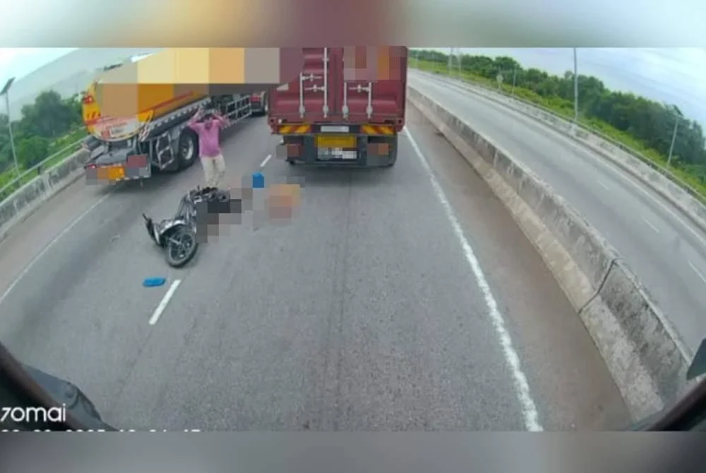 Seorang lelaki meraung selepas melihat isterinya maut digilis treler dalam kemalangandi Jalan Pelabuhan Barat dari arah Pulau Indah menghala ke Klang di sini pada Rabu. 