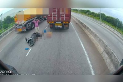 Seorang lelaki meraung selepas melihat isterinya maut digilis treler dalam kemalangandi Jalan Pelabuhan Barat dari arah Pulau Indah menghala ke Klang di sini pada Rabu. 