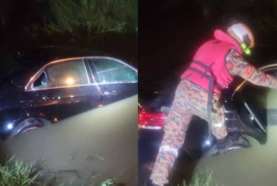 Anggota bomba memeriksa kereta berkenaan dalam operasi menyelamat.