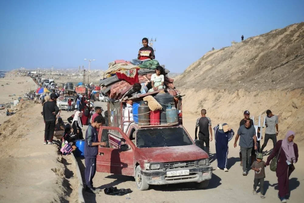 Kebanyakan keluarga kembali menuju ke selatan setelah berpindah beberapa kali sejak lebih 23 bulan lalu. Foto AFP