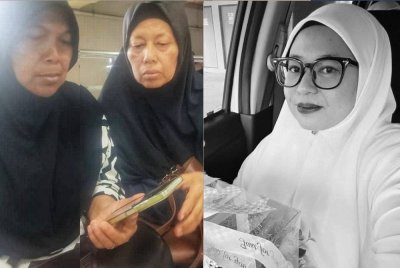 Jumirah (kanan) bersama birasnya, Siti Munipah,65, ketika melihat gambar Allahyarham Herini di telefon bimbit. / Allahyarhamah Herini