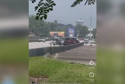 Tangkap layar video yang tular memaparkan kejadian kejar-mengejar di antara polis dan suspek berhampiran Hentian Rehat dan Rawat (R&R) Behrang pada Sabtu.