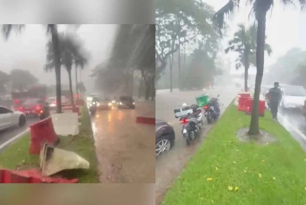 Kenderaan terkandas di laluan Pulai Jaya menghala Taman Teratai, Skudai ekoran banjir kilat yang berlaku. - Foto tular