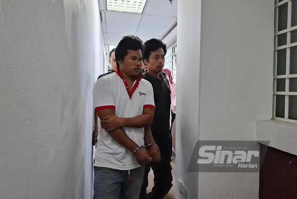 Prosiding pertuduhan membunuh terhadap warga Myanmar, Thien Mg, 31, (hadapan) ditangguh kerana tidak memahami bahasa Melayu dan bahasa Inggeris.