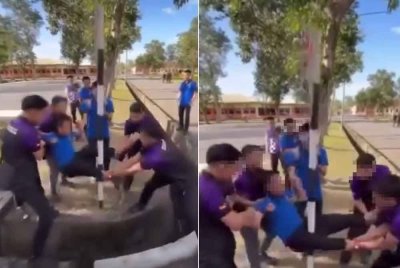 Video yang memaparkan lima pelajar memegang kaki dan tangan seorang pelajar lain dan dengan sengaja ‘menghayunkan’ bahagian kelangkangnya ke arah tiang sebuah papan tanda.