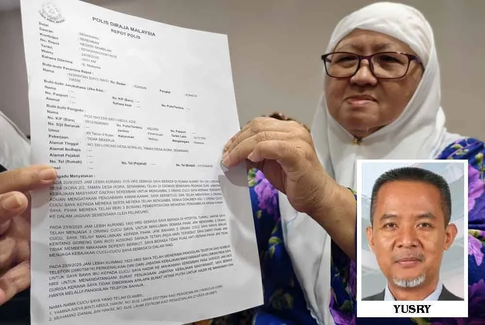 Ros Mayzar menunjukkan laporan polis yang telah dibuat