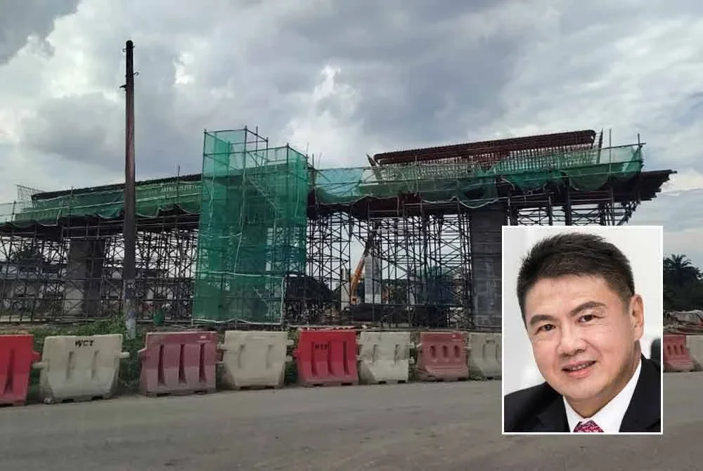 Kerja-kerja pembinaan projek WCE di kawasan Kampung Jawa tetap diteruskan walaupun terdapat 19 pemilik tanah enggan berpindah. Gambar kecil: Yew Chong