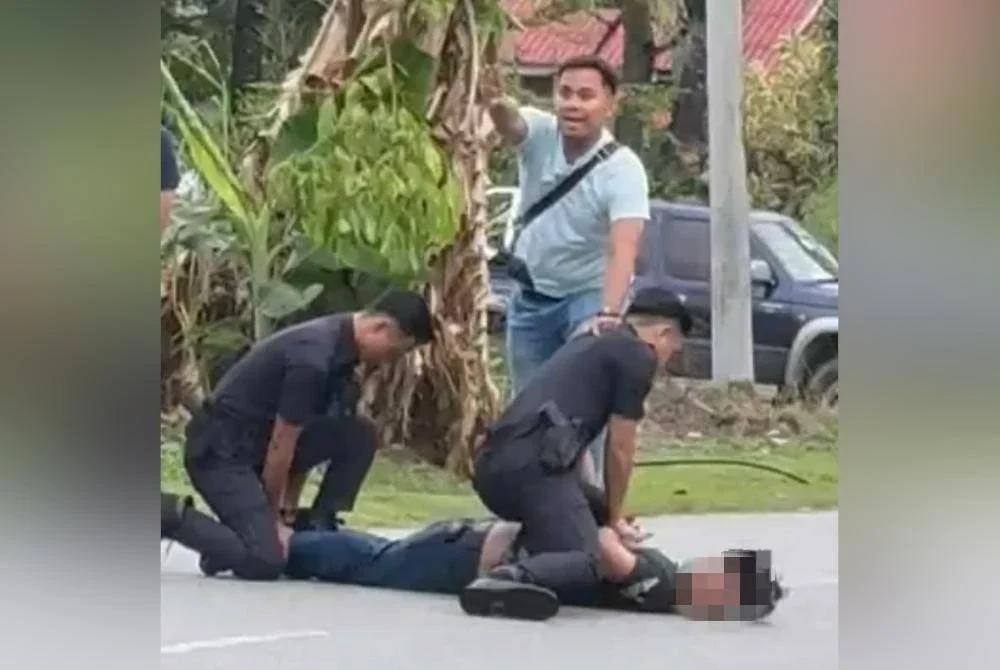 Polis memberkas suspek mengamuk sambil memegang pisau pemotong daging di Taman Jasa, Ijok pada Ahad.