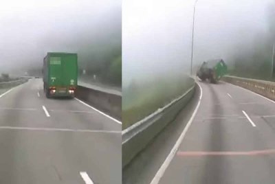 Tangkap layar video yang tular menunjukkan kejadian lori kontena yang terbalik dan melintang di tengah jalan di Kilometer 256.7 Lebuhraya Utara-Selatan arah utara berhampiran Terowong Menora pada Rabu.