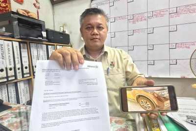 Chin Tsai menunjukkan surat pihak insurans bersetuju membayar tuntutan kehilangan kegunaan kenderaan kepadanya