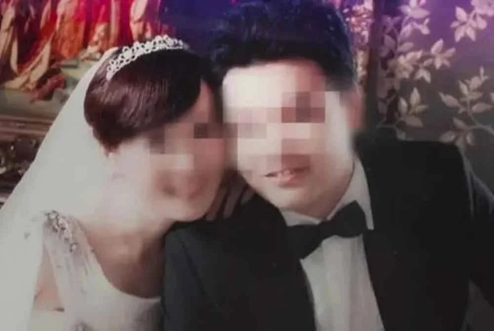 Gambar perkahwinan Chang (kanan) dan Lin. - Agensi