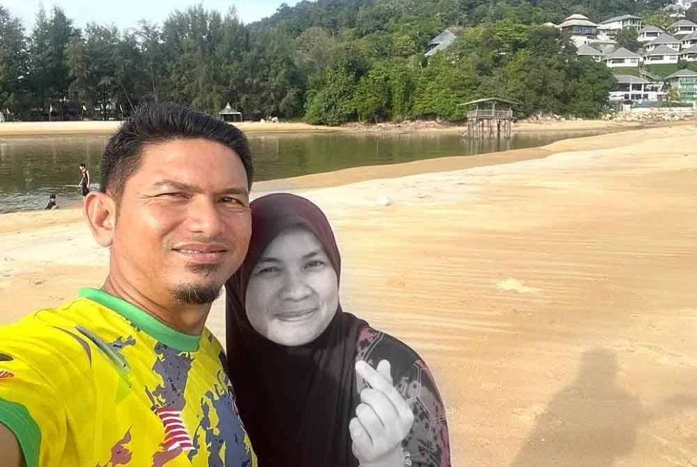 Syafiq Azril bersama Allahyarham Nor Hidayah. Foto Bernama