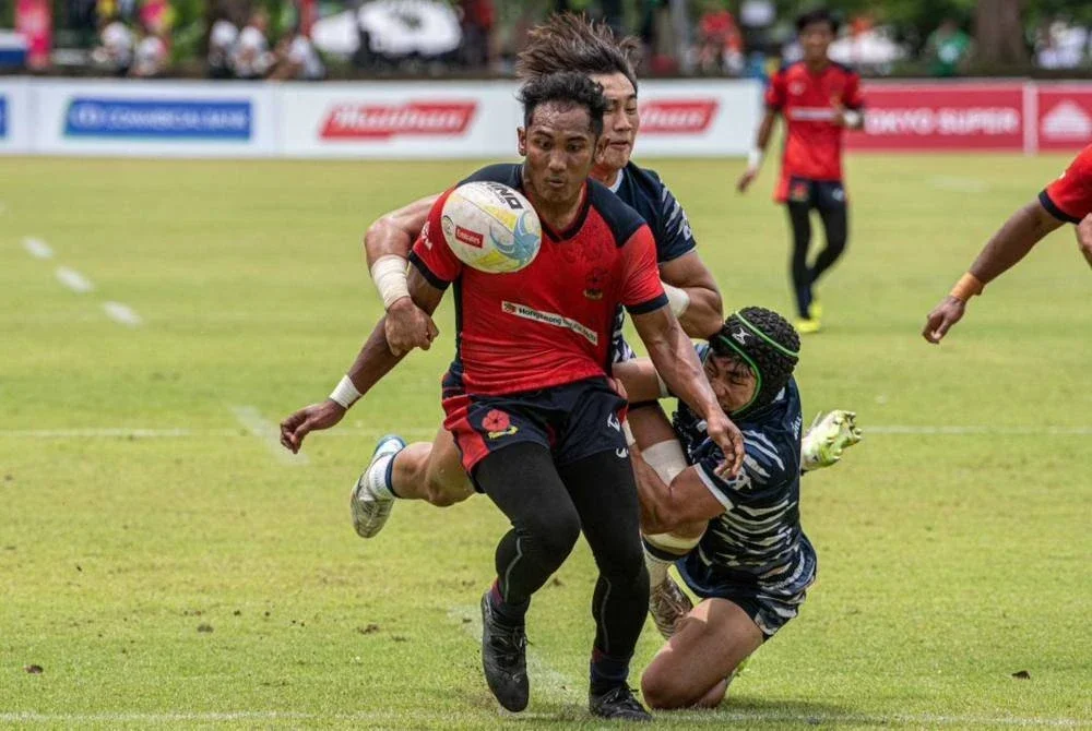 Aksi pemain Bunga Raya negara Harith Iqbal Anhar ketika berdepan Korea Selatan dalam aksi kumpulan Kejuaraan Ragbi Asia 7s 2025 di Colombo pada Ahad. Foto KESATUAN RAGBI MALAYSIA