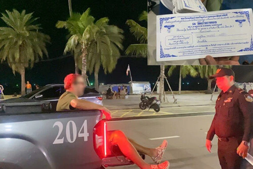 Suspek yang ditahan polis di Jalan Pantai Pattaya. - Foto: Agensi