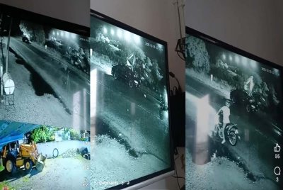 CCTV merakam kumpulan lelaki melarikan jentolak yang diletakkan di tepi jalan.