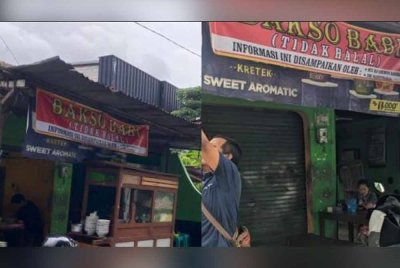 Kain rentang yang dipasang memaklumkan bahawa warung berkenaan menjual bakso babi. Foto Agensi