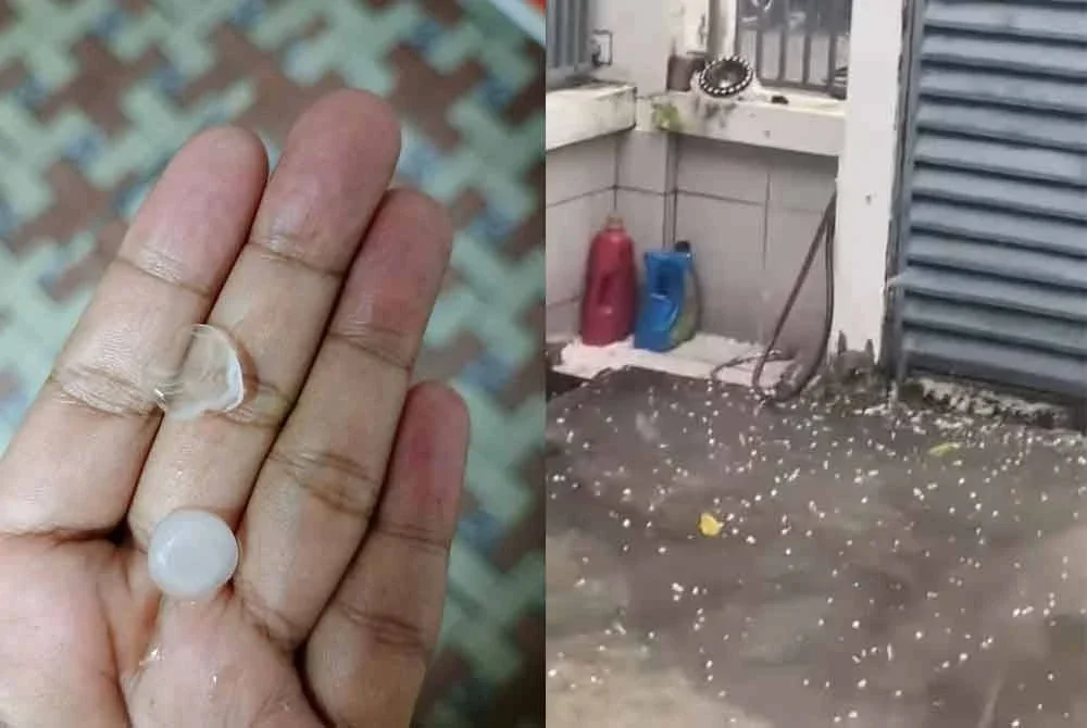 Penduduk mengutip ketulan ais selepas fenomena hujan air batu melanda Ulu Tiram, Johor Bahru pada petang Jumaat.