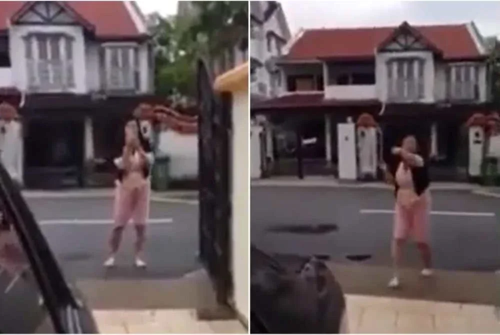 Video tular seorang wanita warga China bertikam lidah dengan seorang penduduk tempatan di luar sebuah rumah mencetuskan kemarahan rakyat Singapura - Foto: SCREENGRAB: NEW_TEACHER_2815/REDDI