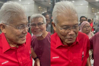 Hamzah (kiri) sempat bertegur sapa dengan Mohd Redzuan sejurus selesai persidangan mesyuarat Majlis Pimpinan Tertinggi (MPT) Bersatu pada malam Selasa.