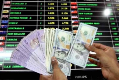 Ringgit dibuka tinggi berbanding dolar AS berikutan laporan KDNK Malaysia yang kukuh. Gambar hiasan