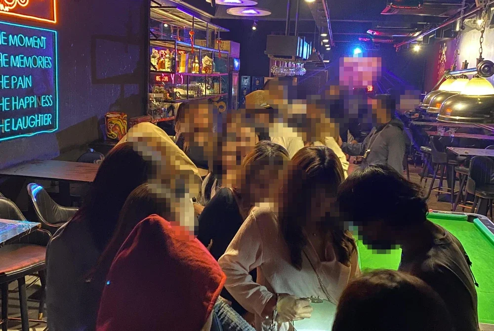 Antara wanita warga asing yang diperiksa JIM dalam serbuan sebuah pusat hiburan di Desa Sri Hartamas, Kuala Lumpur pada Isnin.