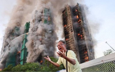 Empat mangsa disahkan maut manakala beberapa lagi terperangkap dalam kebakaran besar yang memusnahkan blok kediaman di Wang Fuk Court, daerah Tai Po. Foto Reuters 