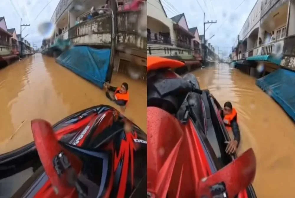 Tular video pasukan penyelamat berdepan ancaman apabila mangsa banjir melepaskan tembakan ke udara di Hat Yai. Foto: Agensi