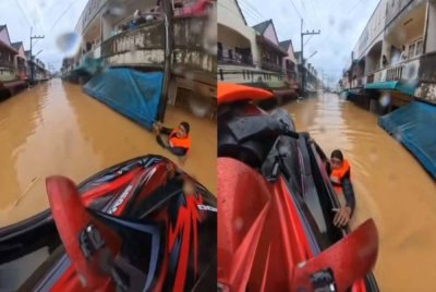 Tular video pasukan penyelamat berdepan ancaman apabila mangsa banjir melepaskan tembakan ke udara di Hat Yai. Foto: Agensi