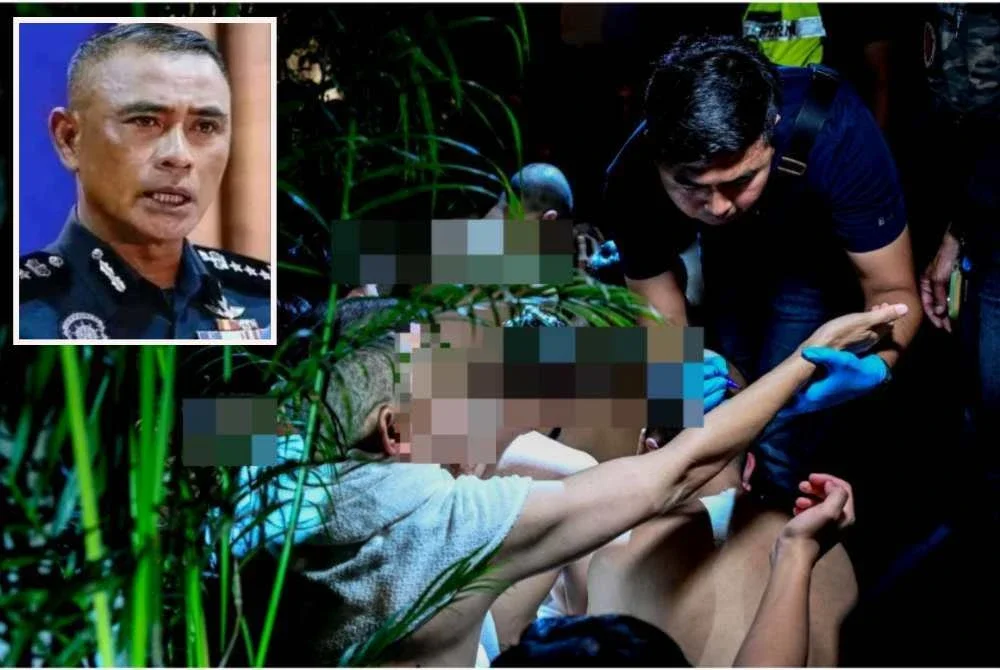 Pegawai penguat kuasa memeriksa salah seorang individu yang ditahan. - Foto: Bernama Gambar kecil (Fadil)