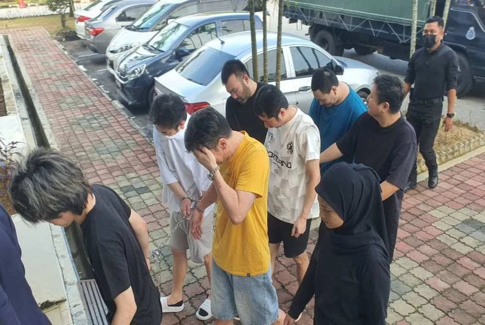 Kesemua tertuduh diiringi anggota polis ketika dibawa ke Mahkamah Bukit Mertajam pada Jumaat.