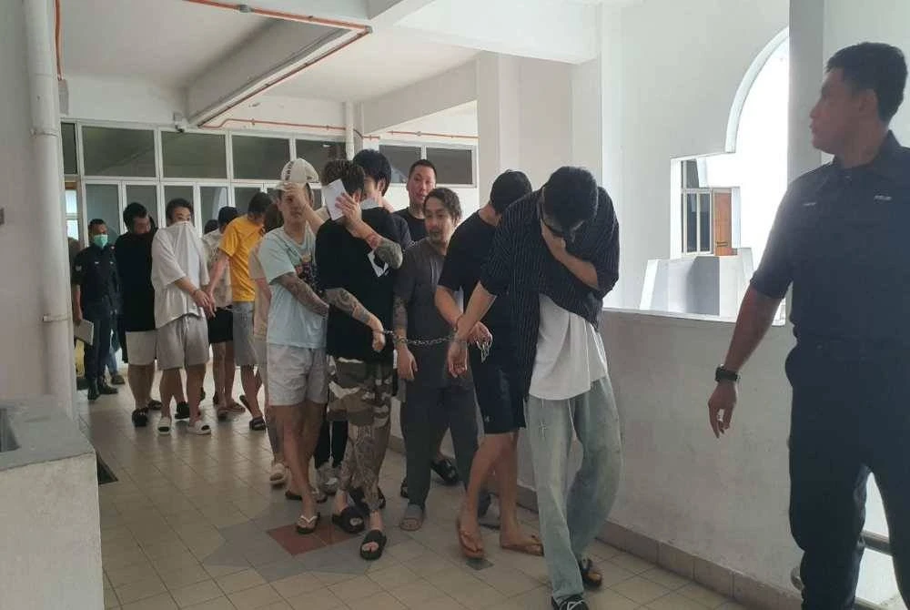 Kesemua tertuduh diiringi anggota polis ketika dibawa ke Mahkamah Bukit Mertajam pada Jumaat.