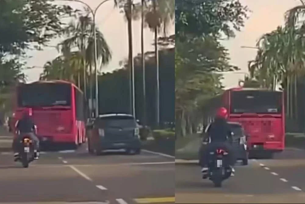 Aksi Perodua Axia dan bas merah jambu yang tular di media sosial pada Rabu.