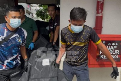 Polis mengangkat mayat seorang wanita yang dipercayai dibunuh suaminya di kediaman mereka di tingkat dua sebuah pangsapuri di Seberang Jaya.