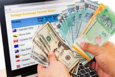 Pada jam 6 petang, ringgit melonjak kepada 4.1040/1105 berbanding dolar AS daripada 4.1155/1195 semasa ditutup pada Rabu. Foto hiasan