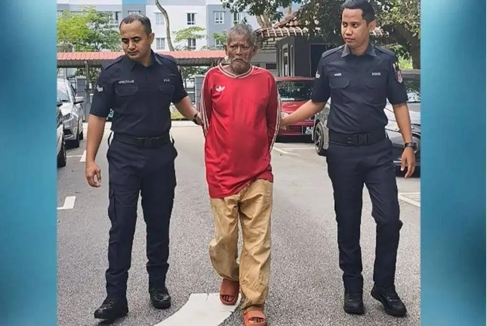 Noor Aini Ismail (tengah) ketika dibawa ke Mahkamah Sesyen Seremban pada Jumaat. 