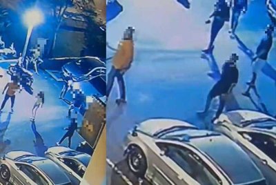 Video tular memaparkan seorang lelaki bersenjatakan parang menyerang mangsa di hadapan kedai serbaneka sebuah residensi Batu Caves pada Ahad lalu.