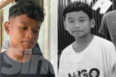 Mohamad Syakir Iqbal (kiri) pilu ketika menceritakan detik tragis menyaksikan adiknya, Mohamad Syafi Irsyad dihanyutkan arus Sungai Ulu Sat selepas terjun untuk menyelamatkannya.