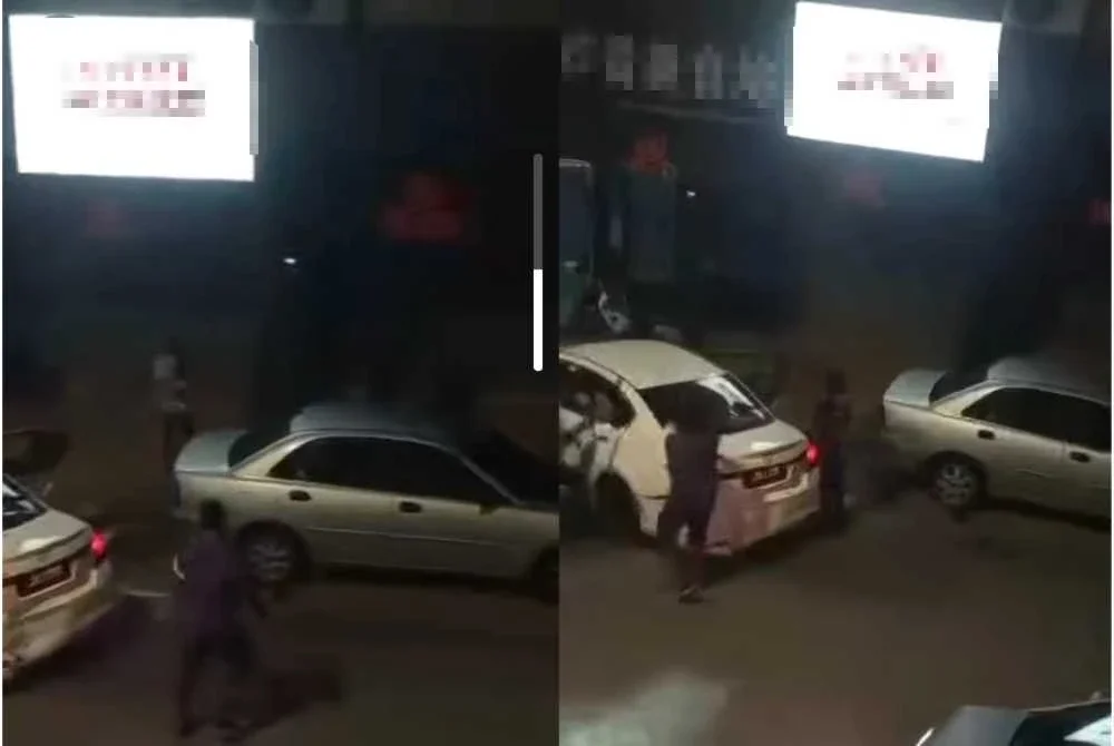Tangkap layar video tular yang memaparkan pergaduhan melibatkan sekumpulan lelaki
