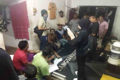 Antara warga asing yang diperiksa JIM Kuala Lumpur dalam operasi di Taman Bukit Angkasa pada Rabu.