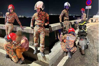 Anggota bomba wanita sedang menenangkan mangsa di lokasi kejadian. Foto bomba 