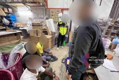 Sebahagian warga asing yang ditahan dalam satu operasi khas di sebuah premis perniagaan di Mount Austin, Johor Bahru pada Selasa. Foto JIM Johor