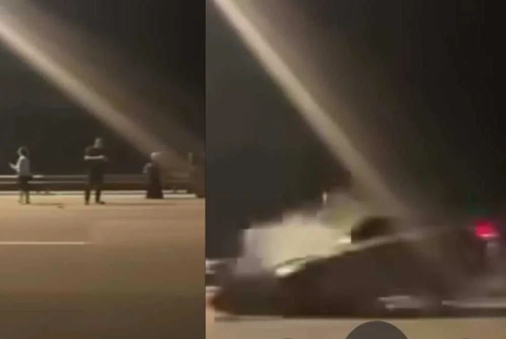 Tiga individu berada di lorong kanan lebuh raya sebelum dirempuh pemandu Mercedes.